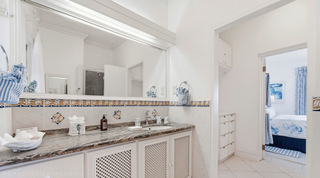 Granite en-suite vanity off Mahogany Bay – Chanel No.5's blue king bedroom, Barbados
