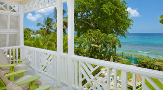 Lime-green recliners on Mahogany Pod's covered terrace, a holiday villa in Paynes Bay, Barbados
