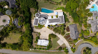 Top-down aerial of the curved pool, rotunda and round paved forecourt at Monkey Hill, villa rental in Sugar Hill, Barbados