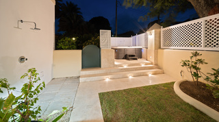 Stone-flagged path and step-lit garden terrace at night, Mullins Bay 13 Coco villa, Barbados