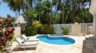 Loungers, a latticed gazebo and coconut palms around the pool of Mullins Bay Villa – Twin Palms, west coast Barbados