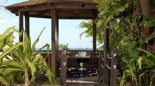 Cliff-side timber gazebo with dining table and sweeping sea views at Mullins Mill, holiday villas in Barbados