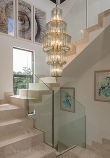 Nirvana villa contemporary chandelier over the staircase full height