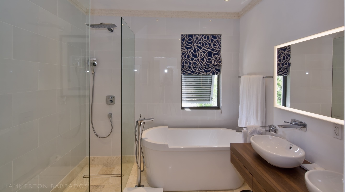 Nirvana villa bathroom with bath and shower