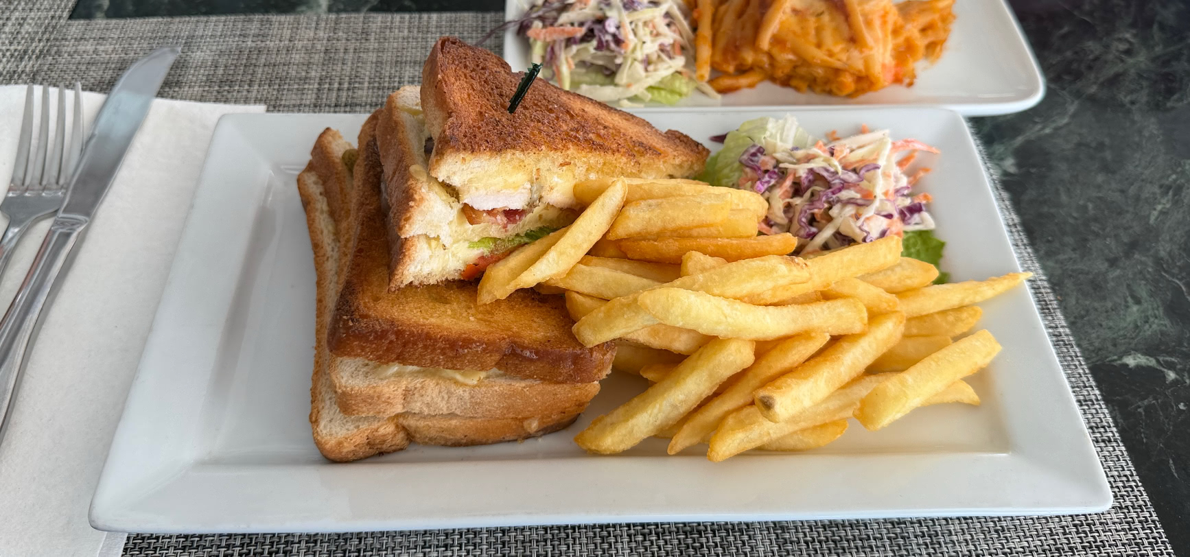 Toasted club sandwich, the Club Toastie, with fries and coleslaw at The Deck, Sugar Hill, Barbados