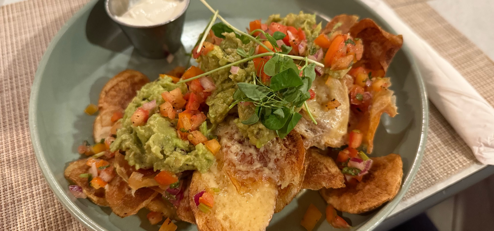 Local Crisp Nachos — house potato crisps with melted cheese, guacamole and pico de gallo