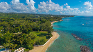 Drone view along the west coast's golden beaches and breakwaters near Queens Fort Pavilion, Barbados