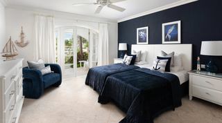Nautical twin bedroom at Royal Villa 17, St. James, Barbados, with navy bedding and anchor cushions