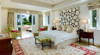 Master bedroom with a pebble-mirror headboard and garden doors, Smugglers Cove 1, Paynes Bay, Barbados