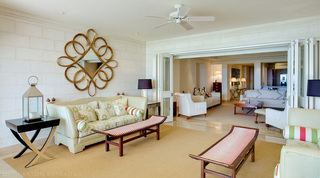 Gilt looping mirror above a sofa in the open-plan living room of Smugglers Cove 1 in Barbados