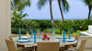 Covered terrace dining table laid for six with sea views, Smugglers Cove 1, holiday apartments Barbados