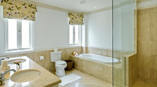 Travertine-tiled bathroom with double vanity, deep bath and walk-in shower, Smugglers Cove 1 Barbados