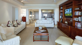Open-plan living room and kitchen at Smugglers Cove 1, a luxury apartment on Paynes Bay, Barbados