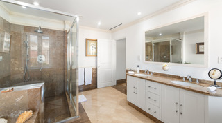 En-suite with twin basins, brown tiled walls and a glass shower enclosure, Smugglers Cove 3 apartment rental, Barbados