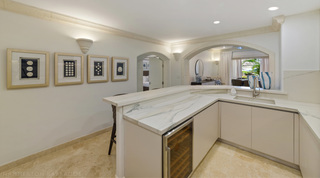 Kitchen peninsula with a wine fridge and framed sand dollars, St. Peter's Bay 106 near Speightstown, Barbados