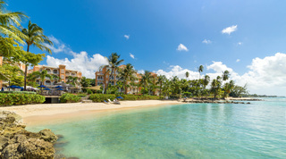Turquoise cove and sandy beach at the St. Peter's Bay resort, home of St. Peter's Bay 106, a luxury apartment in Barbados