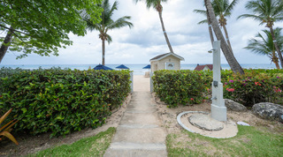 Garden path and gate to the beach with an outdoor shower, St. Peter's Bay 204 near Speightstown, Barbados