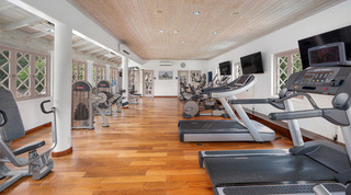 On-site resort gym with treadmills and weight machines, open to St. Peter's Bay 204 guests on Barbados' west coast