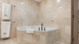 Close view of the tiled corner bathtub and chrome taps, St. Peter's Bay 204 on the west coast of Barbados