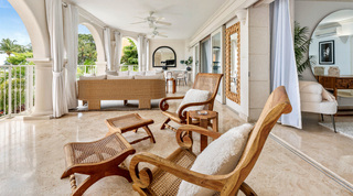 Cane-seat planter's chairs and footstools on the covered terrace of St. Peter's Bay 204, west coast Barbados