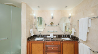 Twin basins in a dark veined top, woven vanity doors and chrome wall lights, St. Peter's Bay 308, apartments in Barbados