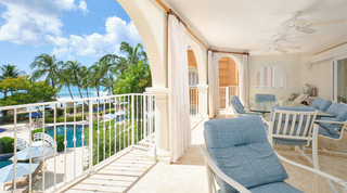 View from St. Peter's Bay 308's terrace rail down to the communal pool footbridge and surf, a beach apartment in Barbados