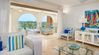 Colourful sailing-boat painting in the living room, open to the terrace, St. Peter's Bay 401, holiday apartment in Barbados