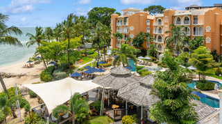 Resort restaurant under a shade sail and shingle roofs by the lagoon pool, St. Peter's Bay 404 near Speightstown, Barbados