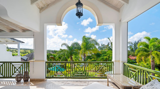 Palm gardens and Royal Westmoreland golf course from the balcony arch of Sugar Cane Ridge 2 – Coral Blu, Barbados