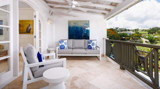 Sugar Cane Ridge 21 – Ruby Blue's covered terrace in Barbados, with a grey sofa and sea-urchin cushions