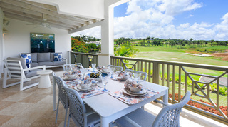 Covered terrace table laid for six above the fairways at Sugar Cane Ridge 21 – Ruby Blue holiday villa, Barbados