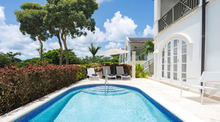 Pool steps, stone deck and arched French doors at Sugar Cane Ridge 21 – Ruby Blue, a villa rental in Barbados