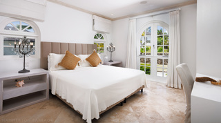 Taupe channel headboard, crystal lamps and arched garden doors in a Sugar Cane Ridge 21 – Ruby Blue bedroom, Barbados