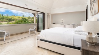 Master bedroom at Tree House Villa 5 opening to a balcony above the golf course fairway, Barbados