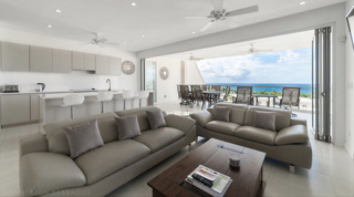 Open-plan living, kitchen and sea-view terrace at Westmoreland Hills 25, a villa rental in Barbados