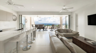 Living room and bar opening to terrace dining and the sea, Westmoreland Hills 25, holiday villas Barbados