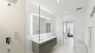 Ensuite bathroom at Westmoreland Hills 25 with double vanity and walk-in rain shower, Barbados