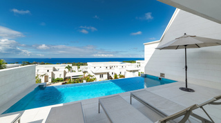Infinity-edge pool with ocean horizon beyond at Westmoreland Hills 25, a luxury villa in St. James, Barbados