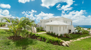 Side elevation of the white contemporary villa with sea beyond, Westmoreland Hills 25, barbados villa